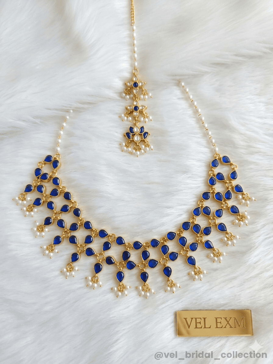 Multi-tiered necklace with blue stone drops